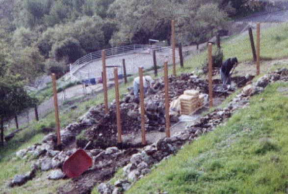 Vegetable garden retaining wall under construction.